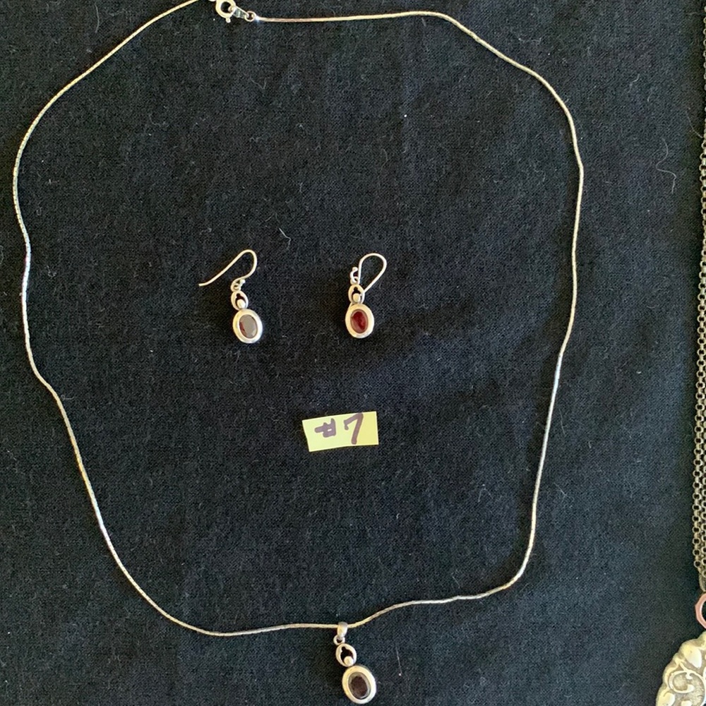Long silver color necklace, earring set with ruby color stones. Make an offer.